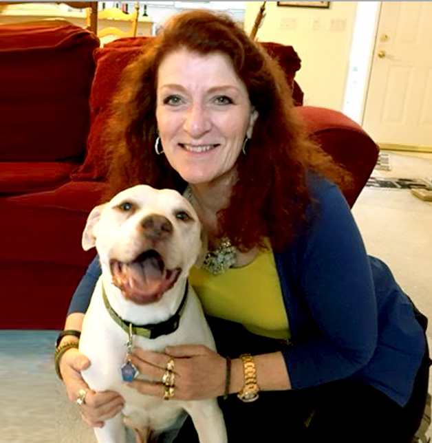 Ike the Terrier mix with his pet partner Ruth O enjoying the day at home