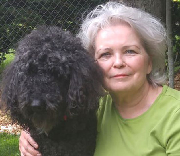Jenel J with her black standard poodle Baron - she has another one named Ebony