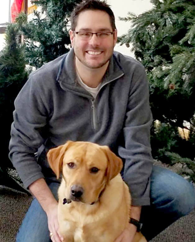 Jared with Hooper, an English Yellow Lab