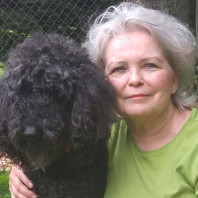 Jenel J with her black standard poodle Baron - she has another one named Ebony