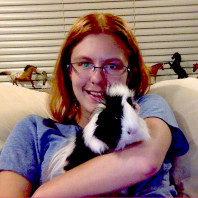Long haired Guinea pig Sybil with pet partner Marcella