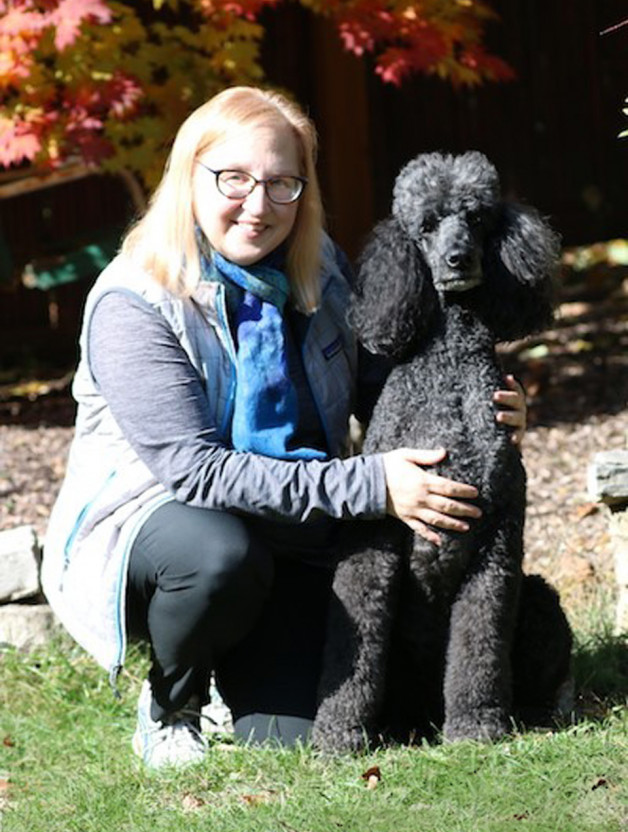 Laurel and with pet partner dog Juneau - gray standard Poodle